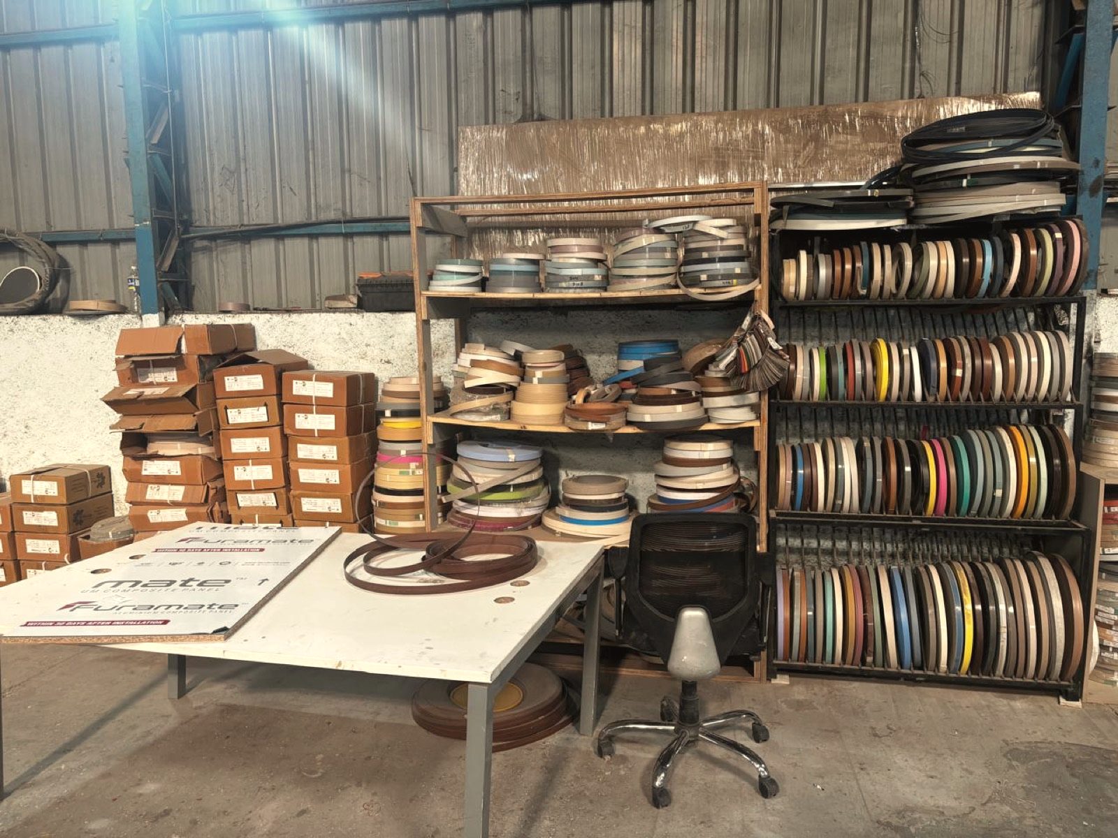 Edge-band rolls in storage at the OutDo factory